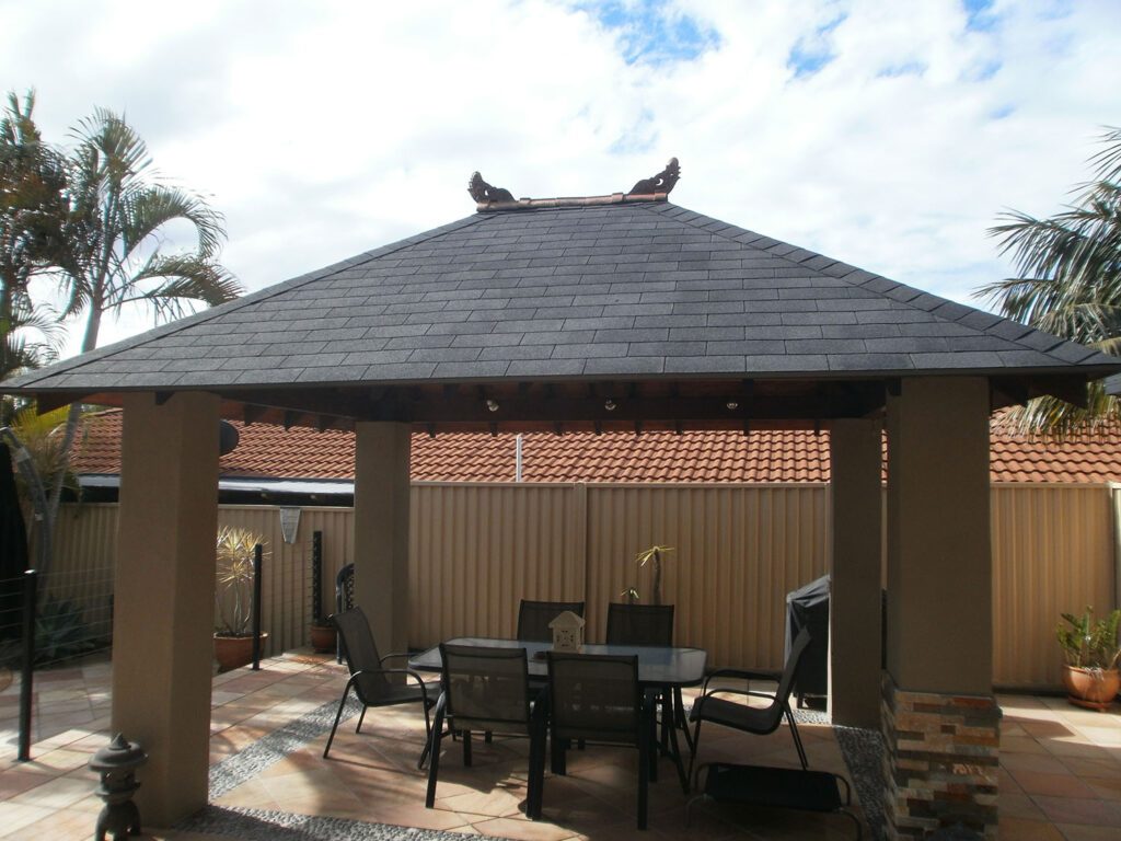 Roofed Pergola Kit Installation Pergola roof kit with premium shingles replacing old thatch