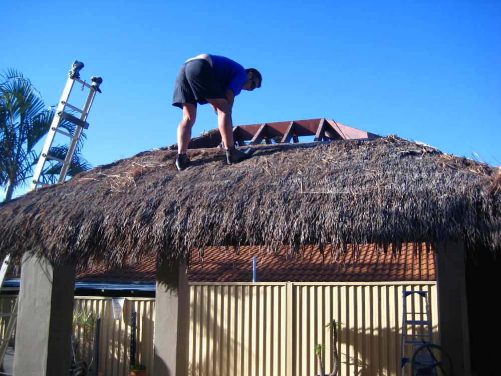 Bali Hut Thatch to Shingles Conversion Bali hut thatch roof replaced with durable asphalt shingles