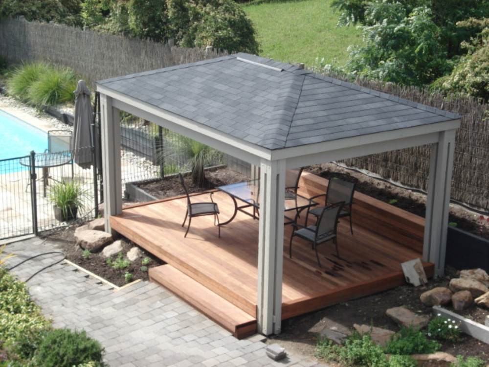 Outdoor living area with fixed gazebos and pergola roofing Australia