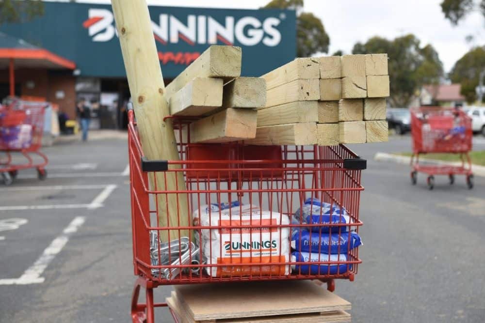 Bunnings shopping trolley loaded with treated pine timber, posts and beams for DIY gazebo build Australia