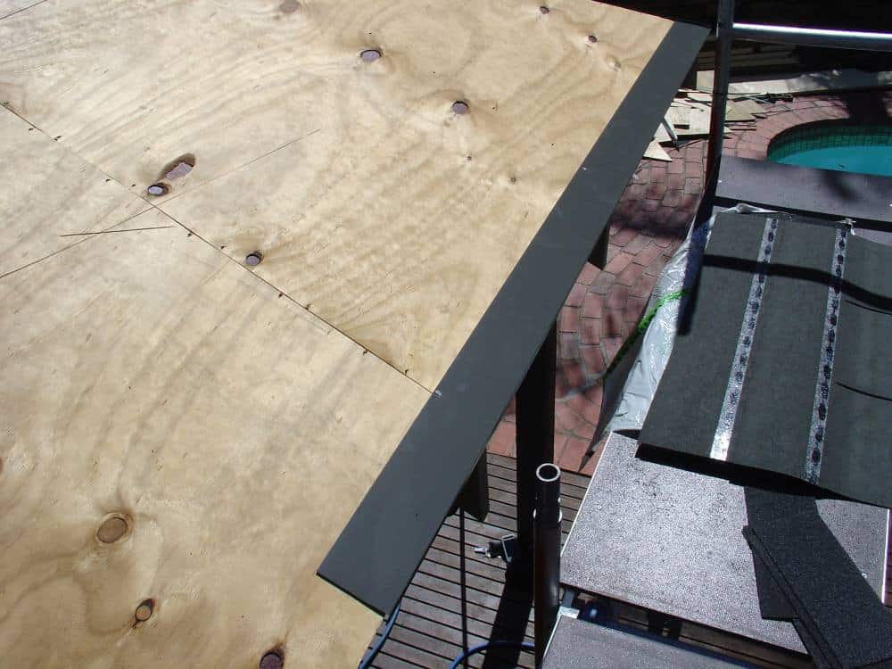 Installing Metal Drip Edge on Plywood Roof Deck Installing metal drip edge along the eaves of plywood roof deck on gazebo